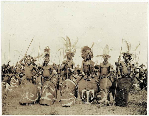 Figure 8 Luo warriors in South Nyanza, Kenya, ca. 1902, attired in warrior dress with spears, shields, and headdresses made of Colobus monkey tail hair and ostrich plumes. The style of adornment and shields are typical of the late nineteenth and early twentieth century period for the Luo. (Pitt Rivers Museum Luo Visual History, Citation2008)