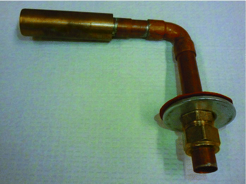 FIG. 1 Photograph of a shrouded nozzle sampling system showing the shrouded inlet piece, the bend, and the outlet tube with the mounting assembly.