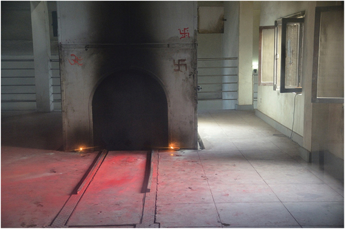 Figure 5. PADT electric crematorium furnace with traces of ritual offering with auspicious red powder. Photo by author, 2017.