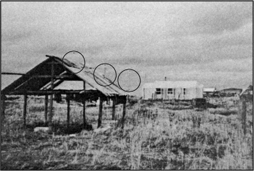 Fig. 3 Three 10-kW wind generators were originally sited in Unalakleet in the early 1980s behind the fish drying rack in the foreground. This was one of the first utility scale wind generation systems installed in Alaska. Kotzebue Electric Association was one of the first utilities pioneering the use of wind generators in Arctic Alaska.