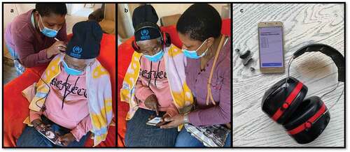 Figure 2. (a): Participant’s ear canal and tympanic membrane being evaluated by a CHW via video-otoscopy. (b): Participant having a hearing assessment via in-situ audiometry and circumaural ear cups. (c): Hearing aids, smartphone, and circumaural ear cups used in service-delivery model.
