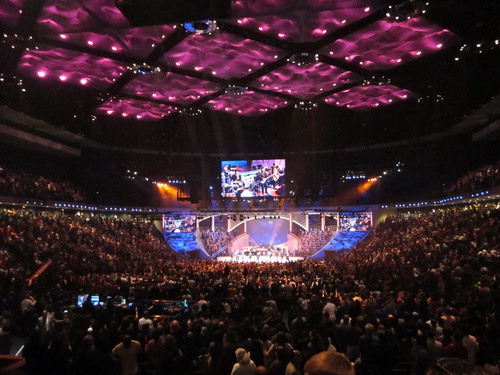 FIG 2 Colour cloud ceiling illuminated in purple hues at Lakewood Church during worship phase. Photo by the author, 2012.