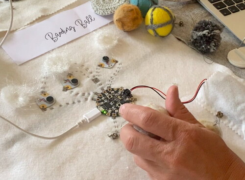 Figure 5 Baoding Ball being squeezed and tested with multiple haptic motors.