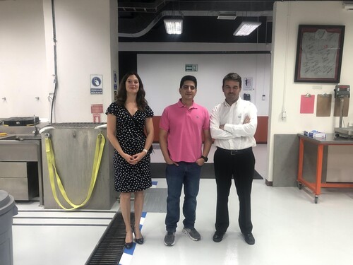 Eva Lantsoght with Jose Matos and Francisco Jativa at the materials lab