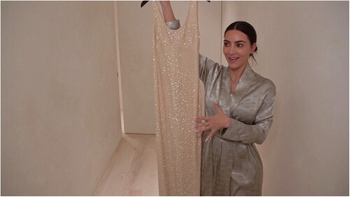 Figure 5. Kardashian holds a replica of the ‘Happy Birthday’ dress sent by Ripley’s Believe it or Not! Image courtesy of Hulu.