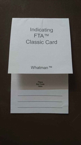 Figure 3. The FTA® is a paper-based system that allows the collection and storage of DNA (mostly from blood and buccal swabs) by dabbing a bit of the fluid into one of the pink circles inside the card. It allows a quick and safe storage of DNA without the need of liquid nitrogen and freezers, making them a practical alternative when sampling in the field. Unfortunately, the cards are expensive and only allow 4 samples per card. Such technologies make the collection, transportation and subsequent storage of DNA/biomaterials as conservation proxies possible (Photograph by Esther Breithoff).