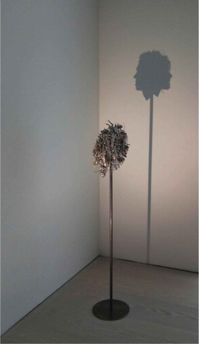 Figure 7. Tim Noble and Sue Webster. The Masterpiece. 2014. (Sculpture, Sterling silver, metal stand, light projector). 153 × 24 x 37.5 cm. (Artwork copyright © Tim Noble & Sue Webster. Photograph by the authors).
