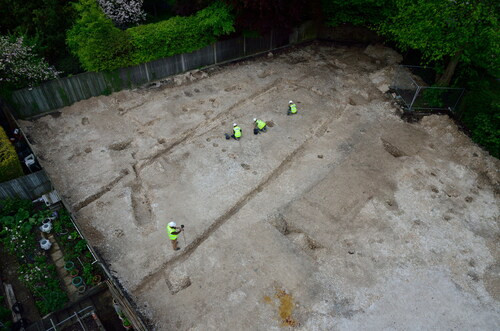 fig 8 Building B3 during excavation looking southeast. The wall trenches and perpendicular postholes of a possible partition are clearly visible.