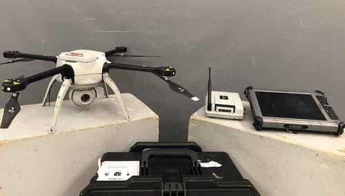 Figure 3. Aeryon Labs Skyranger UAV system equipped with the SR-3SHD payload (left), base station and tablet (right).