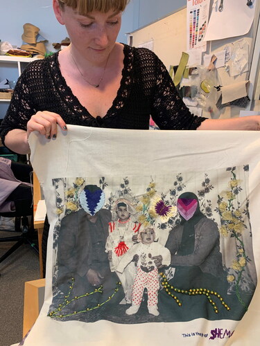 Figure 9 Solveig Søndergaard demonstrates an art piece signed by Sheema. Embroidery on printed fabric. July 2021. Solveig Søndergaard and refugee and migrant women in Kolding and Tingbjerg made use of their own childhood memories. From the artistic textile work project Stitched Stories. Photo: Marie-Louise Nosch.
