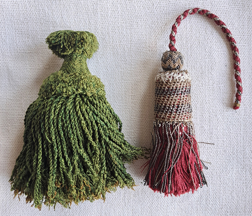 Figure 4. Silk and metal thread tassels, seventeenth or eighteenth century. Private collection. Both tassels have a wooden core. The red tassel on the right has metal thread details worked with a needle.