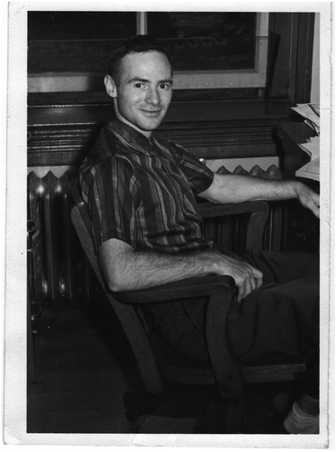 Figure 1. Young Larry Bliss at his office desk at the University of Illinois (1959).