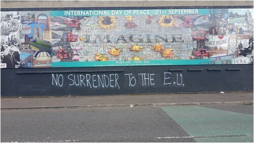 Figure 2. Graffiti beneath a peace mural, Northumberland Street, Belfast, September 2019.