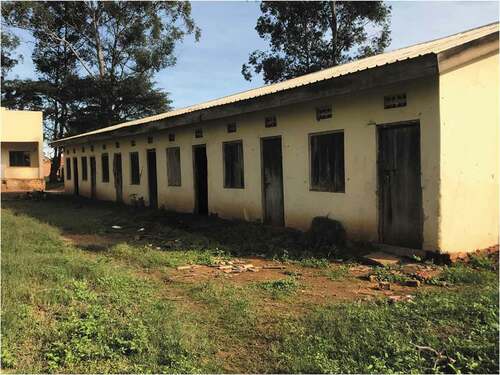 Figure 2. Unions provided dormitory-style housing to men and women near coffee factories, such as the old muzigo (single-room) style building depicted. Kalisizo, Uganda. Photo by the authors.