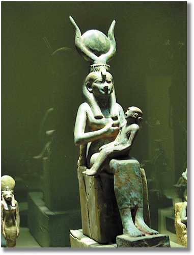Figure 11. This small statue of Auset (Isis in Greek) shows her nurturing her baby son Heru (Horus). Heru would eventually become the savior figure in the legendary traditions of Ancient Egypt. The resemblance between the iconography of Khemet’s Auset and Heru when compared with the Christian World’s Mary and Christ is truly uncanny. (The Museum of Saqqara, Egypt; Williams, Citation2014).