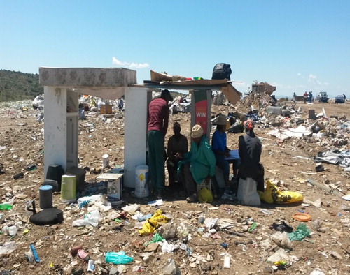 Figure 6. Landfill waste pickers protecting themselves against the sun at the BN landfill site. Source: Authors.