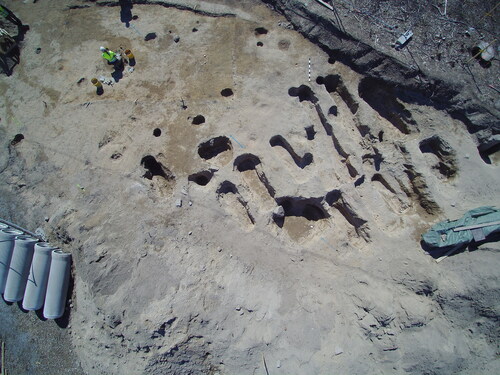 Fig 4 Aerial view of the clustered oblong pits during the excavation (the top of the picture is towards north). Photograph by M Helamaa 2017, Muuritutkimus Oy.