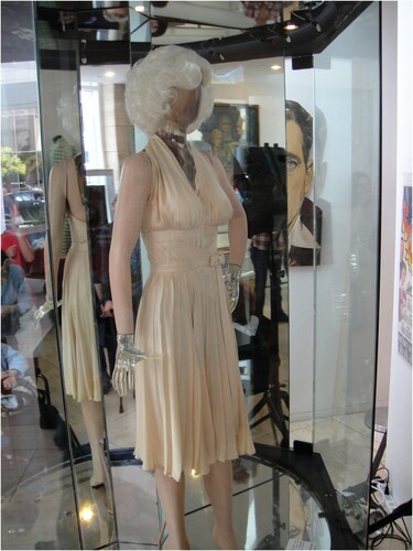 Figure 6. William Travilla’s pleated halter dress for Monroe displayed on a mannequin. Photo by Doug Kline, from Wikimedia Commons.