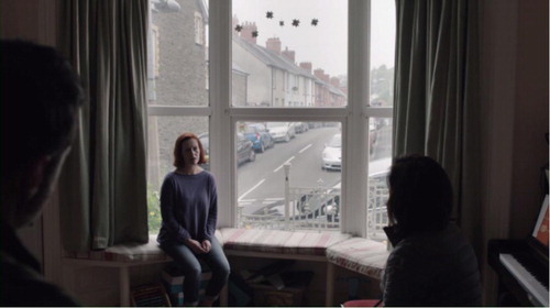 Figure 4. The passive woman, sitting down, restricted to her home; Mathias is elevated as he perches on the arm of a sofa (in ‘Both Barrells’, Murphy & Bryn, Citation2016).