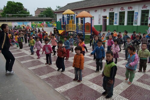 Figure 3. Scheduled morning exercises in the outdoor play area.