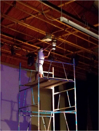 Figure 2. Employee with no personal protective equipment working above 2 m height with no guardrails on two sides of the scaffolding. Picture courtesy of K. Khiba.