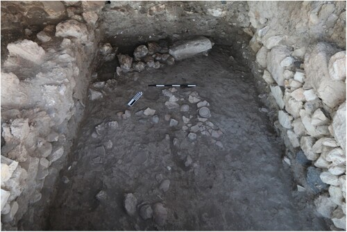 Figure 7 Floor 14/Q/106 of Level Q-8 below remains of Level Q-7, looking north (courtesy of the Megiddo Expedition).