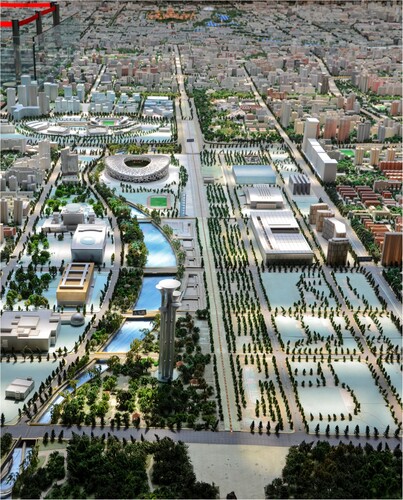 Figure 1. Model of the Olympic Precinct in Beijing. Source: The author.Note: This photo shows the location of the Olympic precinct in Beijing in a reversed north–south orientation. It shows an explicit north-south axial line that links the Olympic precinct with the city’s structure. This photo, taken in September 2016, is part of the city’s model displayed in the Beijing Planning Hall.