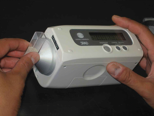 Figure 1 A picture showing measurement of a soil sample packed in a plastic cell with SPAD-503.