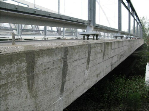 Figure 1. A bridge edge beam in Sweden with cracks that have been injected and sealed.