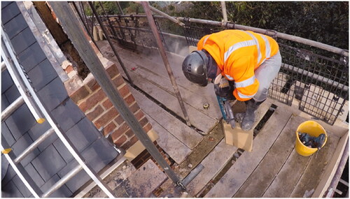 Figure 1. The bricklayer cuts the coping stone with the petrol disc cutter. This is a still from video footage taken by the principal author using a handheld camera.