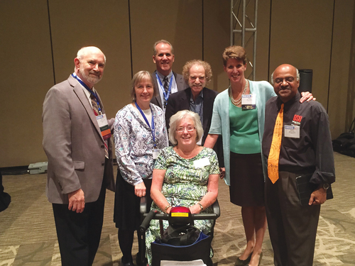 Katherine Wallman (seated) surrounded by former ASA presidents. From left: David Morganstein, (2015), Jessica Utts (2016), Miron Straf (2002), Sally C. Morton (2009), Sastry Pantula (2010), and Nat Schenker (2014) in the back.