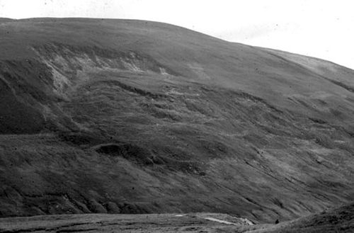 Figure 6 Arrested translational rockslide in Glen Roy (Lochaber). The slide has disrupted and over-run shorelines formed at the margins of a lake that was dammed by glacier ice during the Loch Lomond Stade