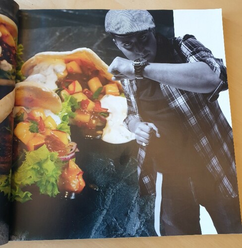Figure 4. Page in the cookbook Kung i köket (2010, photographer Znapshot/Per Erik Berglund) which shows chef Fredrik Björlin in a boxing pose (2019-09-17)