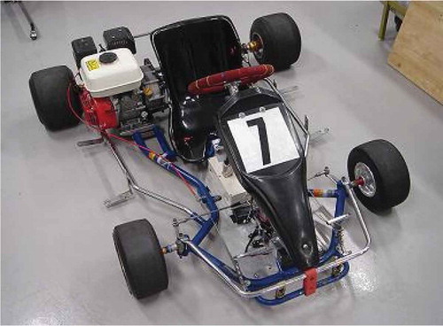 Figure 2. Race kart used as a simple surrogate vehicle model. The race kart consists of a frame, an engine next to the seat, a rear shaft, frontal steering components and tyres.