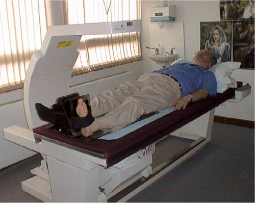 Figure 1 DEXA set up demonstrating the Hologic foot positioner for prosthetic hip patients.