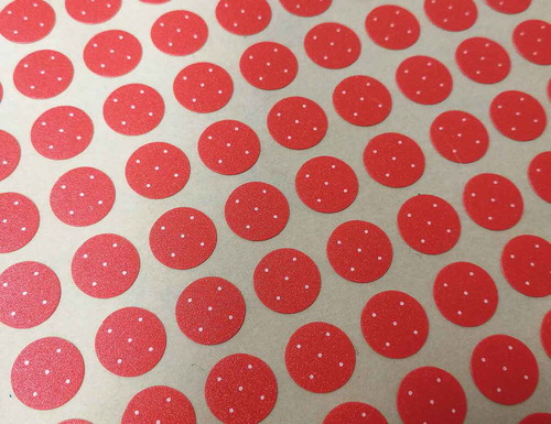 Figure 3. A sheet of follicle size guides. Each sticker bears five dots, each of diameter 0.5 mm.