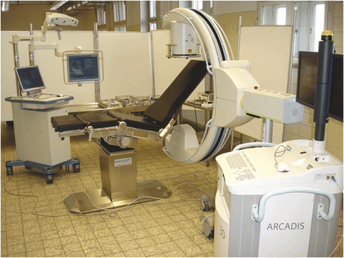 Figure 1. Operative setting of the navigated procedure using a 3D image intensifier and a radiolucent shoulder table.