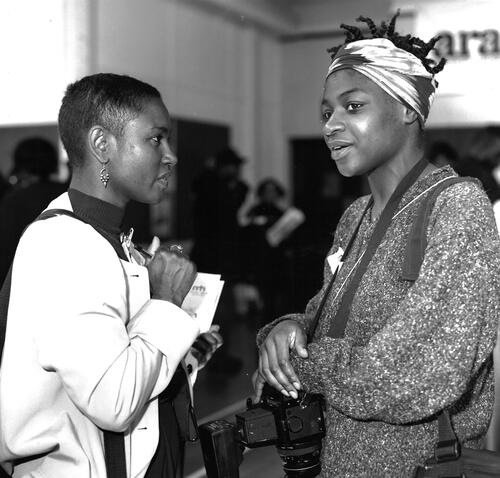 Figure 3. Anita J. McKenzie and another photographer in conversation. BCA ref: AC2014/66/4B.