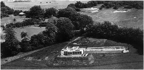 Figure 1 Bungalows at Whipsnade Zoo Estate, Whipsnade. Photograph c. 1936, RIBA Collections as published in “Bungalows at Whipsnade,” Architectural Review 81 (1937): 60–4. Hillfield (“House A”) is in the foreground and Holly Frindle (“House B”) is to the back. On the left center is Springfield, the house of Geoffrey Vevers.Footnote1 According to the letter Tess Vevers writes to Lubetkin, this third house was named Springfield, and was demolished in 1980 “to make way for a brick house on three levels for David, Director of Zoos, and his family.”Footnote2 Springfield might have been designed by Edward T. Salter according to the drawings kept at the RIBA collections, but no evidence of the construction of the building or the actual design has been found. Salter also designed other buildings in the Whipsnade Zoo such as the lavatories and a kiosk. Springfield was demolished and a new bigger house was built on its place.Footnote3