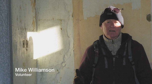 Figure 4. Screenshot from ‘Recording Loss’ showing one of the volunteers as filmed inside the Bomb Ballistics Building.