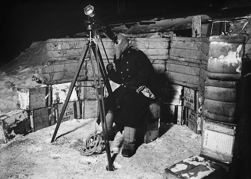 Fig. 1. Lieut. Evans observing an occultation of Jupiter. 8 June 1911. Ref. P2005/5/442. Photographer: Herbert G Ponting. Flashlight photograph. Print from orthochromatic glass plate negative. Scott Polar Research Institute, University of Cambridge, with permission