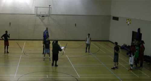 Figure 3. Team A take positions on court, Team B look on.