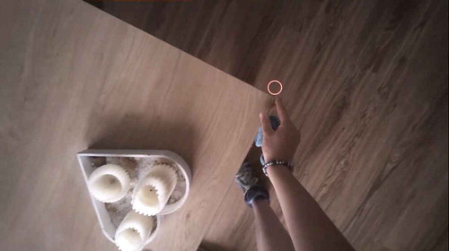FIGURE 18  Compulsive touching: A participant in Diana Beljaars’s research has to feel the tip of the table in her right index finger during cleaning. Photo is a still from an eye-tracking video recording owned by Diana Beljaars. (Color figure available online.)