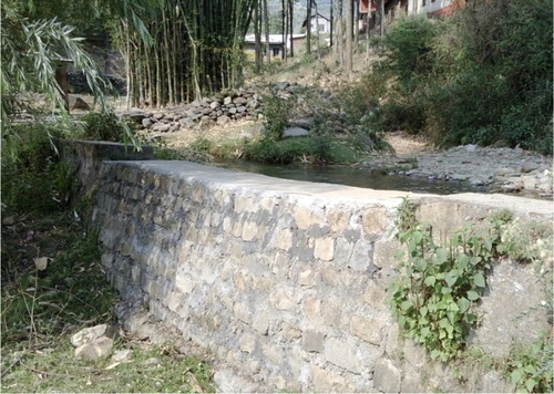 Figure 6. The upper layer of the retaining wall was repaired following damage of a storm, helping to ensure continued water availability downstream.
