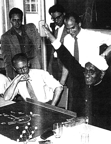 Figure 2. Wilhelm Maier (seated left) with Sir Raman (seated right) in the Institute of Physical Chemistry, Freiburg, 1956 (photograph by W. Lüttke).