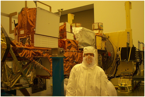 Figure 4. Claire in a TRW cleanroom with the Aqua spacecraft, 19 December 2001.