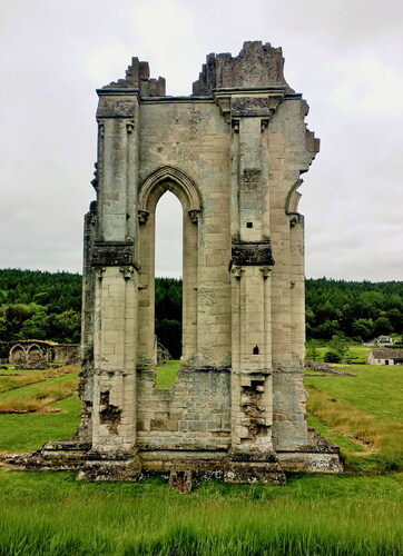 Fig. 37. Kirkham Priory: east front, showing capitals on the corners of the buttresses and the partial outline of circular window at top right to light the north presbytery aisleJ. Phillips