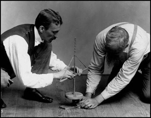 Figure 13. Archaeologist and ethnologist for the Department of Anthropology, Walter Hough, demonstrating the fire pump drill, National Museum, Smithsonian Institution. Photograph most likely taken around 1890 in preparation for Hough’s publication on fire-making tools, American Anthropologist (1890). National Anthropological Archives, Smithsonian Institution (MNH_5614a).