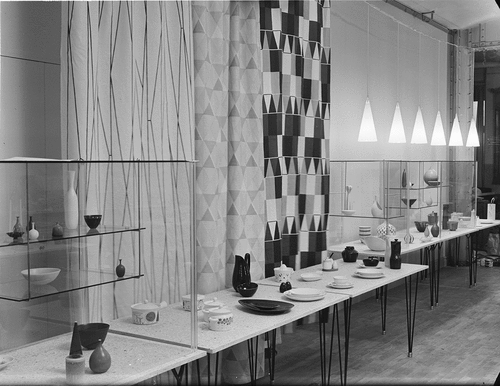 Figure 7. View of the “test” installation at Frey’s Warehouse in Stockholm, March 22, 1954, showing the combination of textiles, display furniture and ceramic objects. Photographer Sune Sundahl. ArkDes, Stockholm. ARKM.1988-111 -16,333. Public domain.
