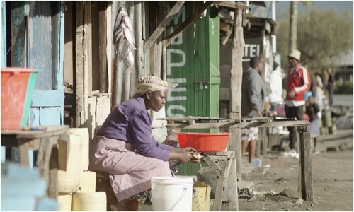 Figure 7. Market woman preparing potatoes and fish for sale (film still © Anna Lisa Ramella and Ben Bernhard).